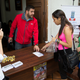 David Smolansky talks to a woman at El Hatillo town hall in Caracas in 2014.